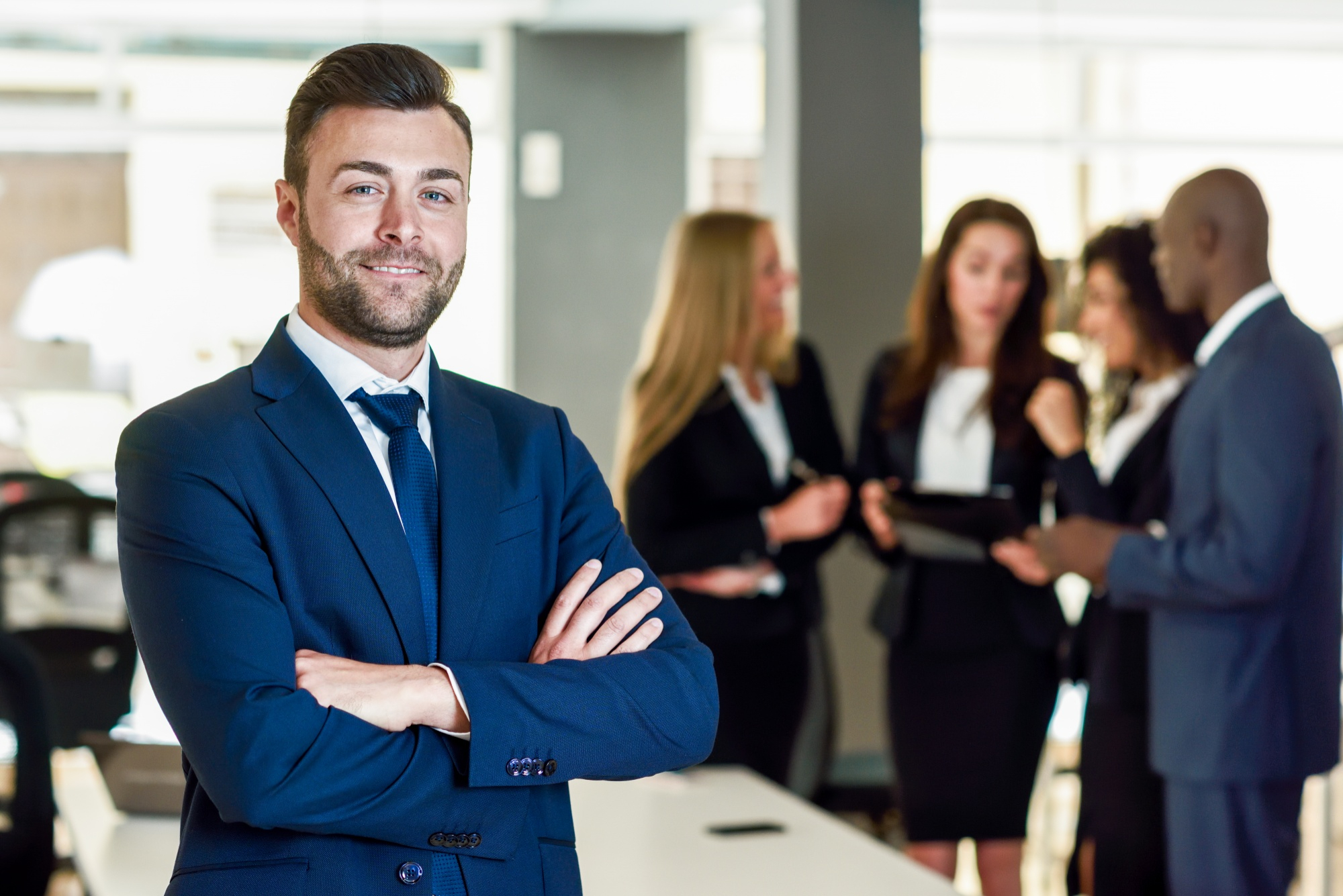 businessman-leader-modern-office-with-businesspeople-working.jpg